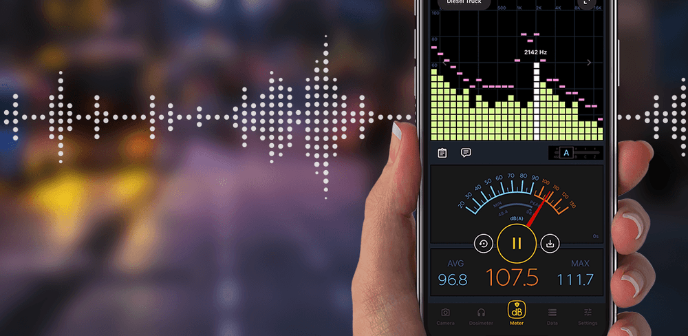 The Decibel X app on a phone with a sound wave in the background.