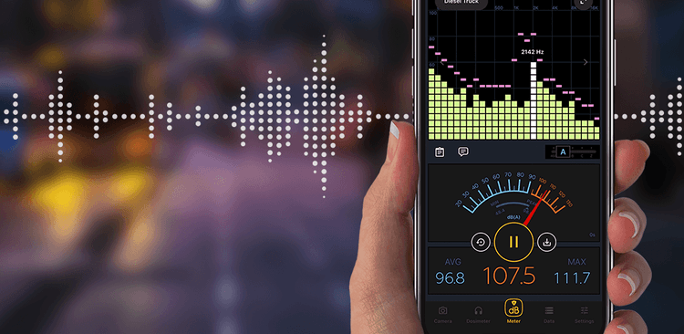 The Decibel X app on a phone with a sound wave in the background.