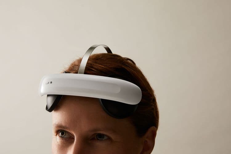 A photo of the Flow headset on a woman's head.