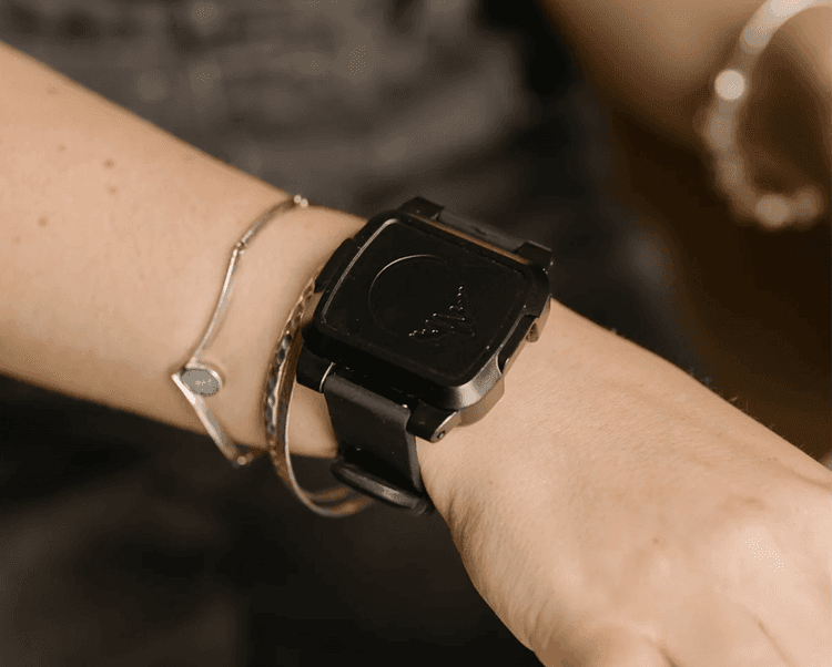 The BeechBand alongside bracelets on a wrist.